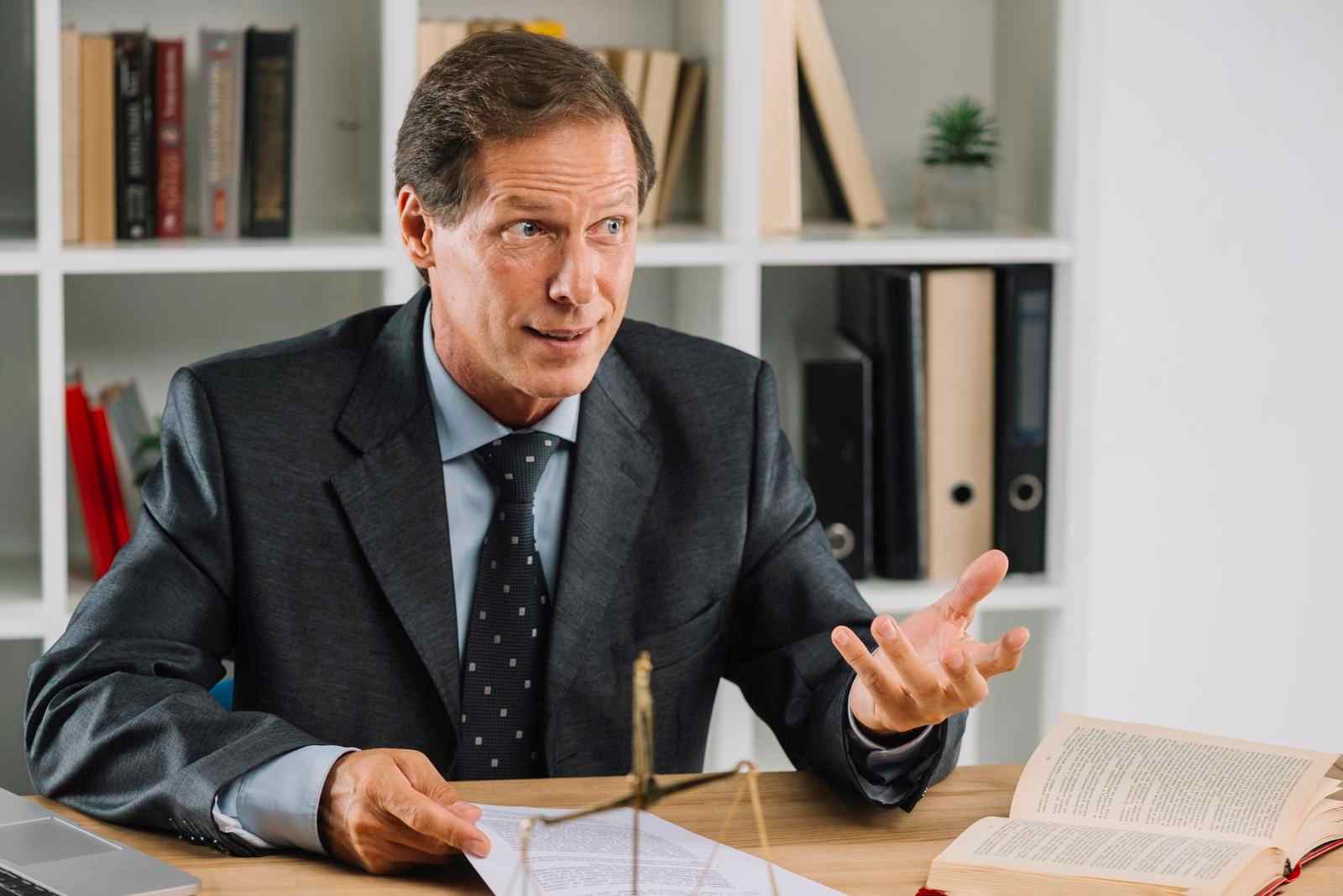 Image of a mature lawyer having a conversation in a courtroom, featuring the 411 Divorce logo and highlighting 'Protecting Your Rights and Interests with Legal Counsel,' aligning with the page's focus on legal support during divorce proceedings.